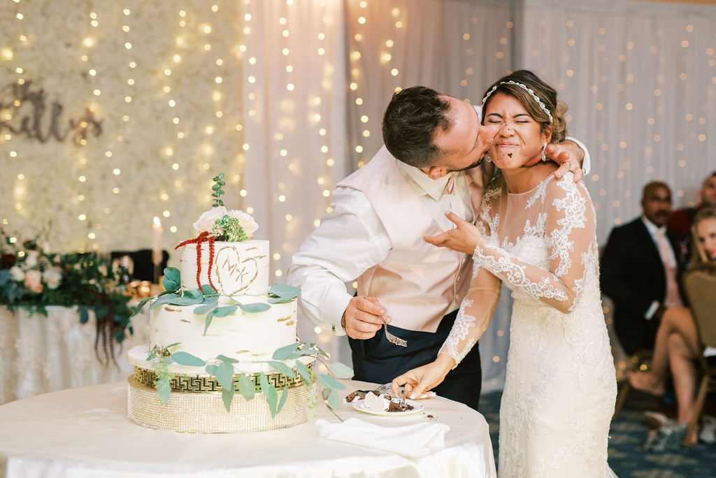 bride and groom cake cutting photo