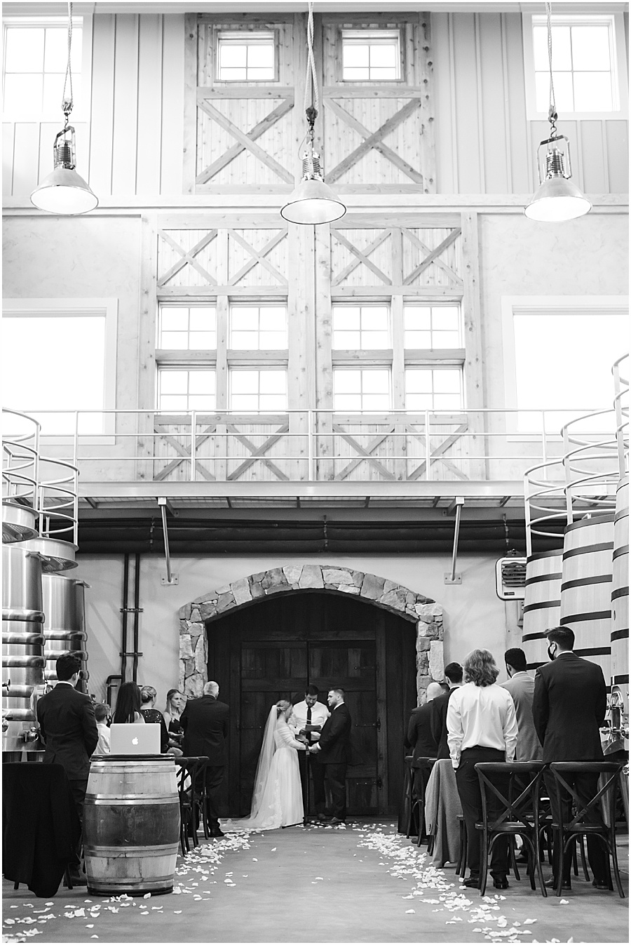 black and white ceremony photo from stone tower