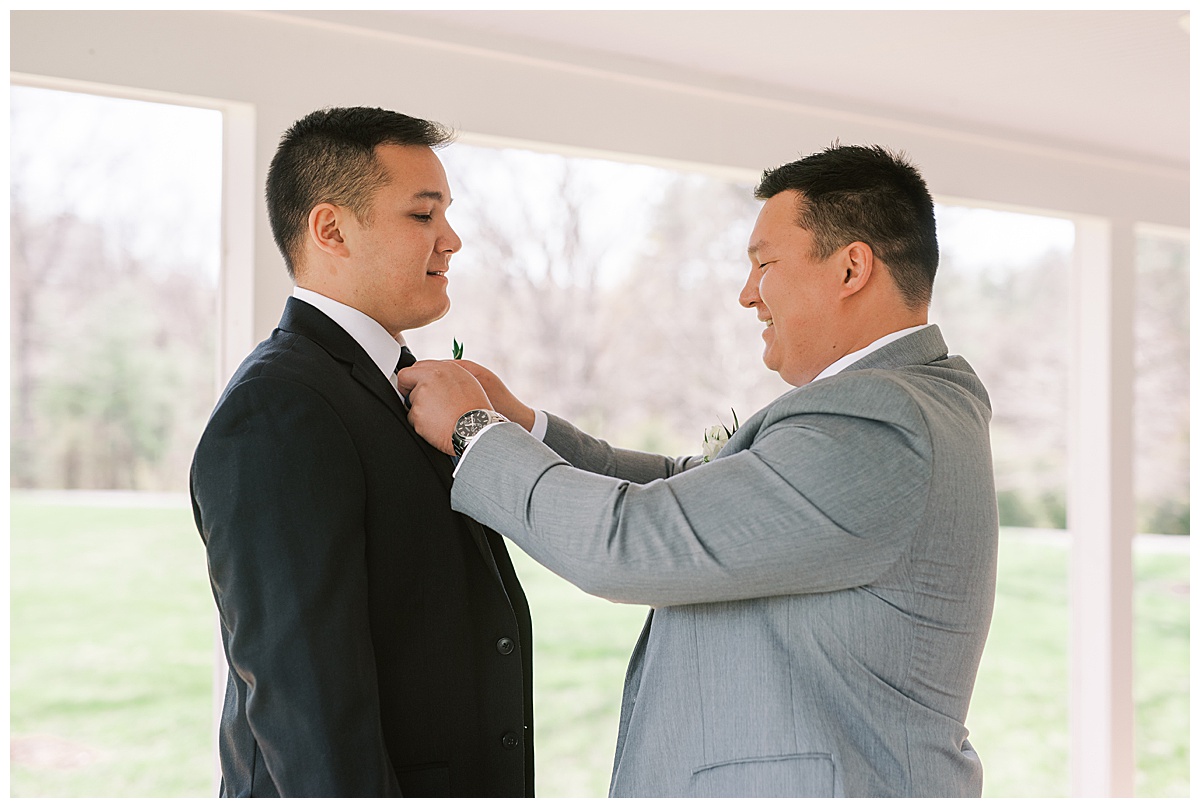 father and groom getting ready photo