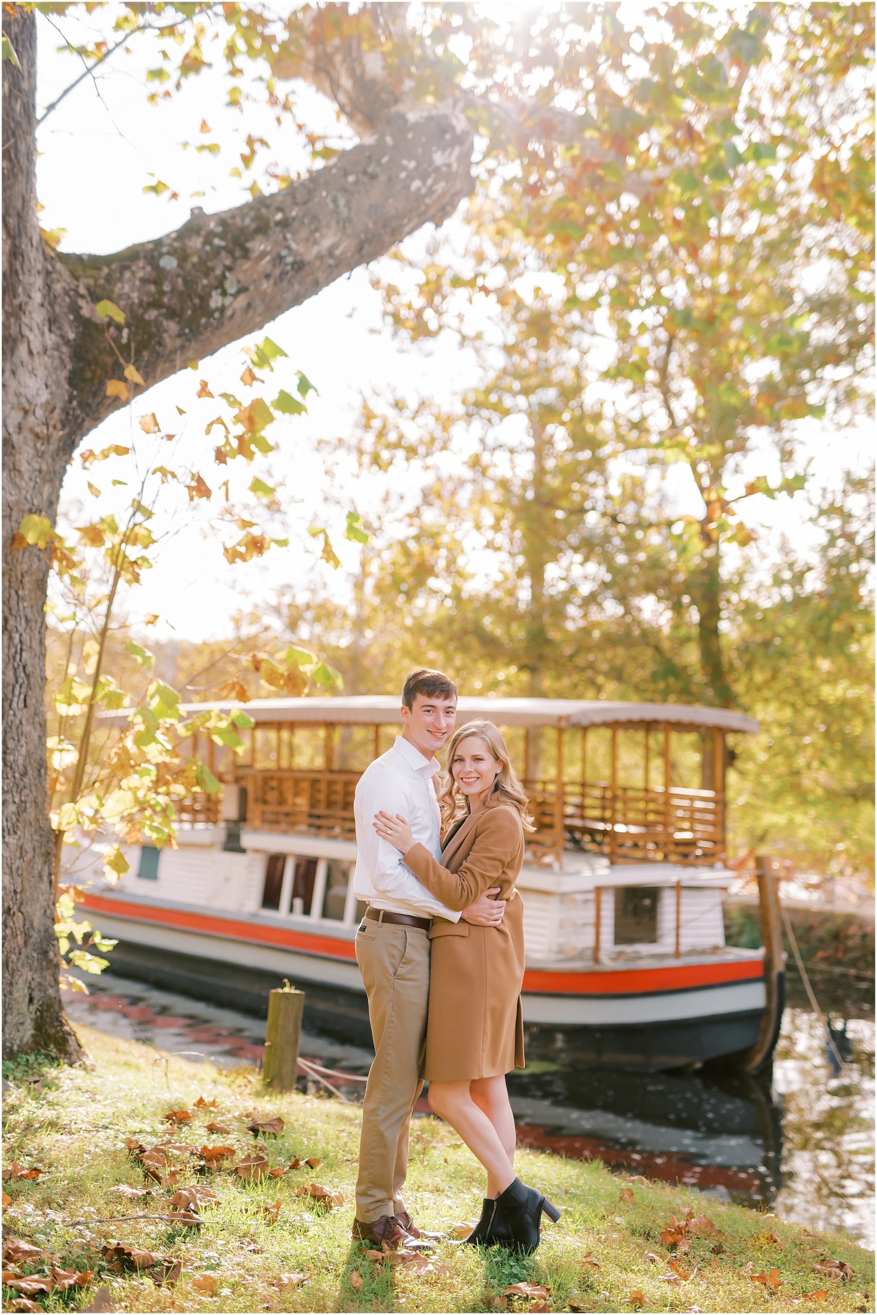 Couple posing in front of boat at Great Falls Park