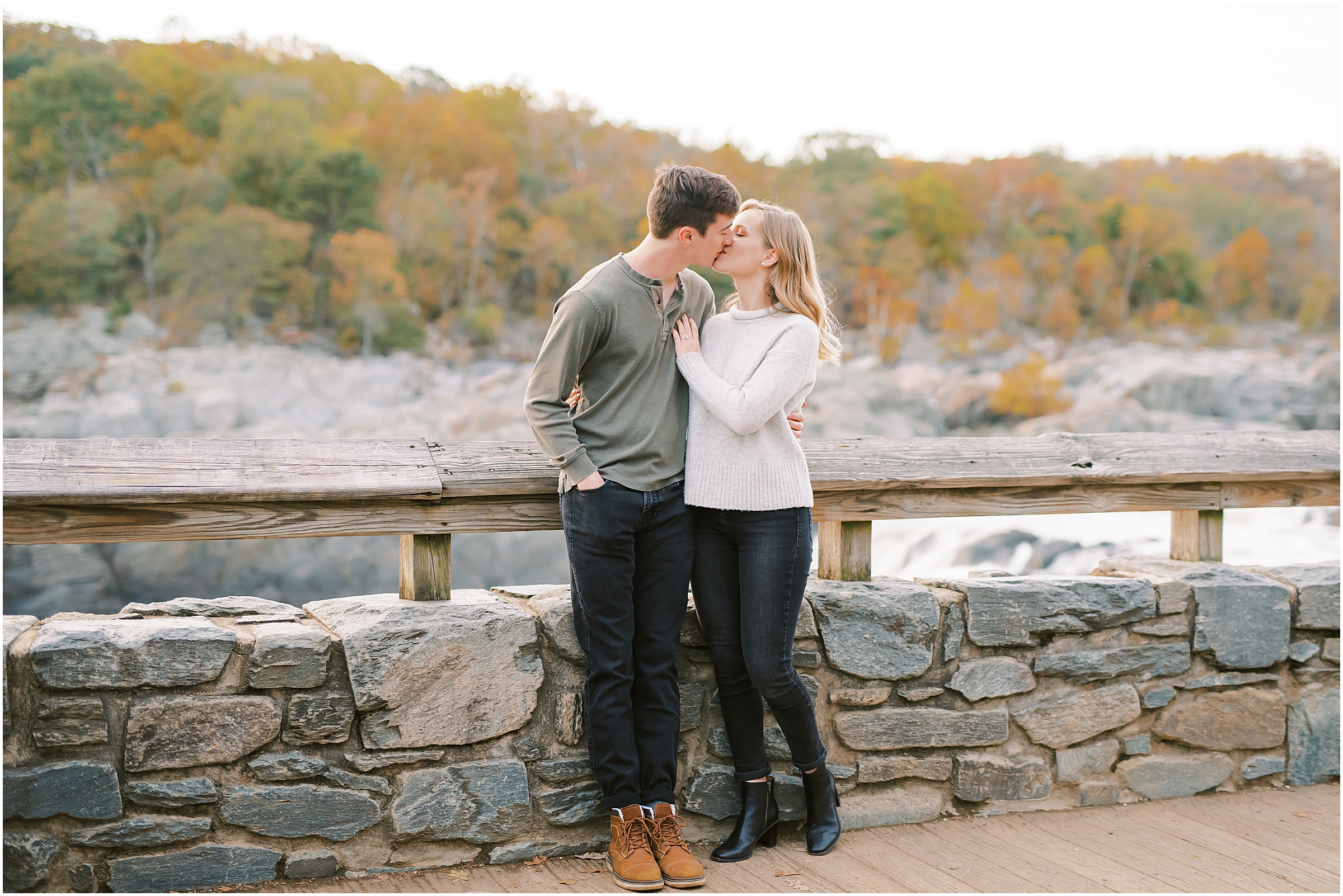 Couple kissing during autumn engagement session at Great Falls