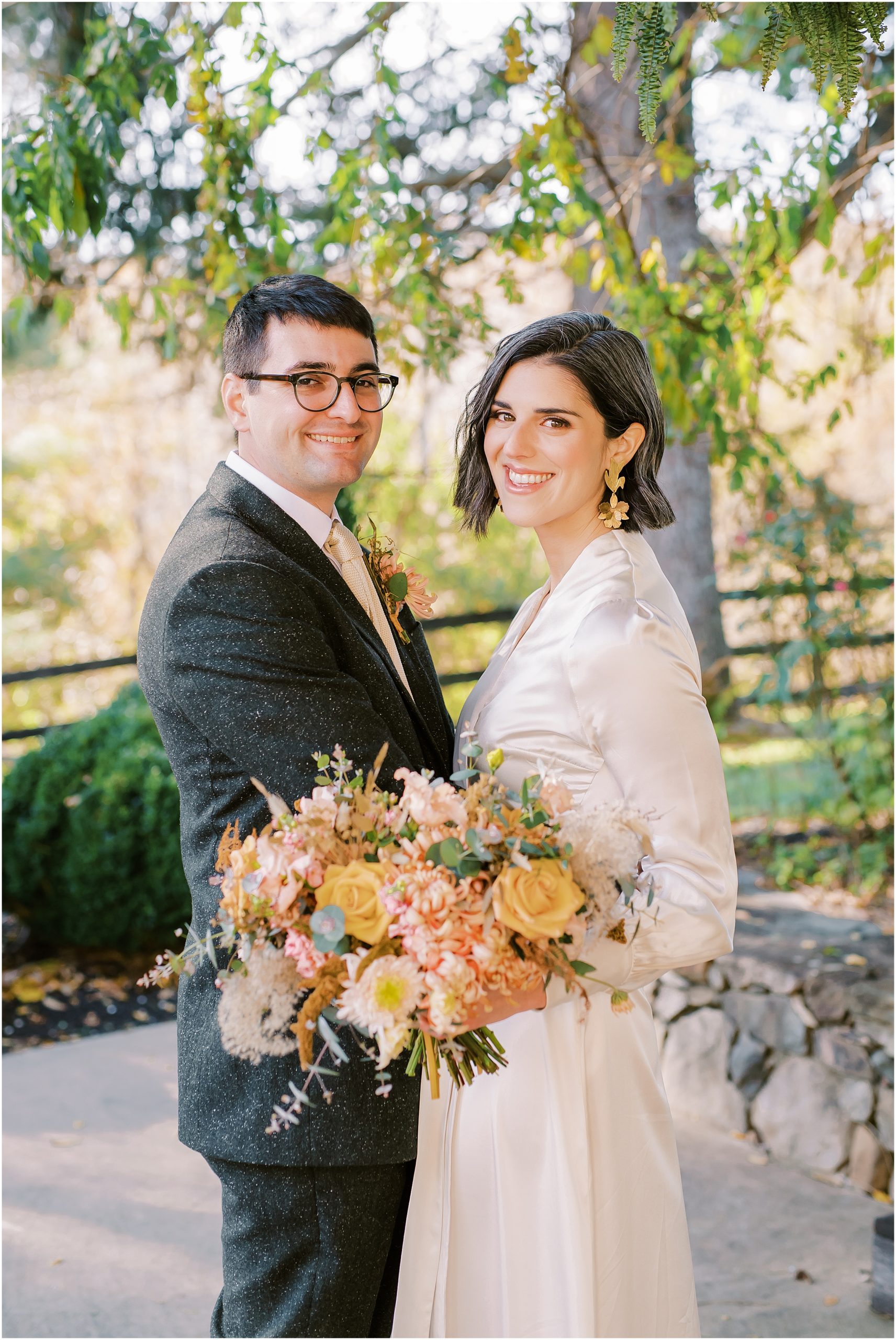 Wedding couple portrait with full bouquet