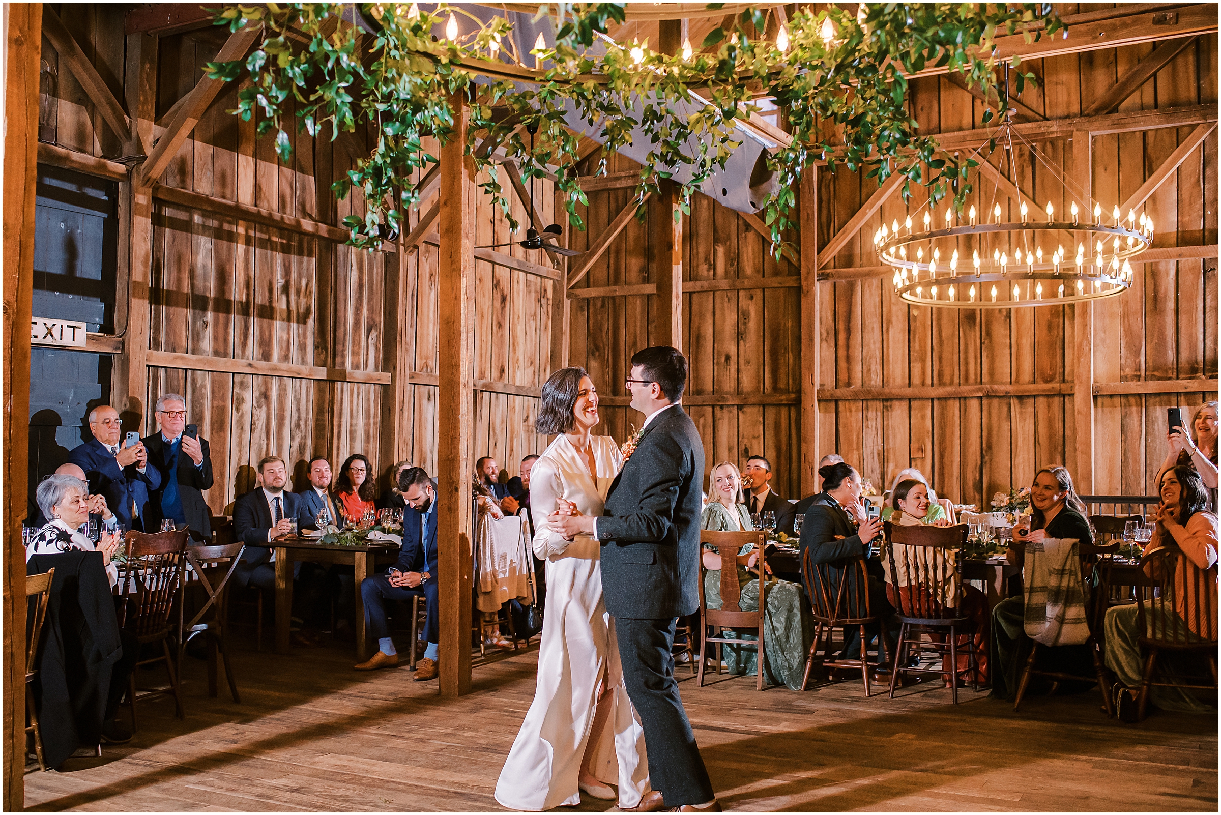 Bride and groom share first dance during winter market themed wedding