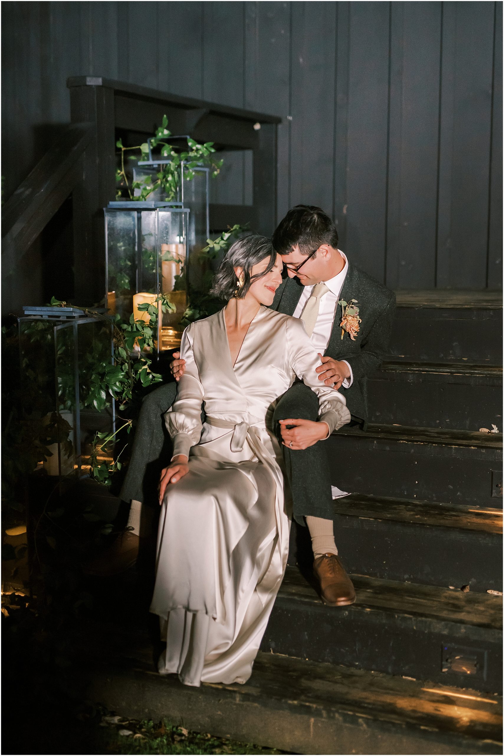 Newlyweds embracing at night during winter market themed wedding