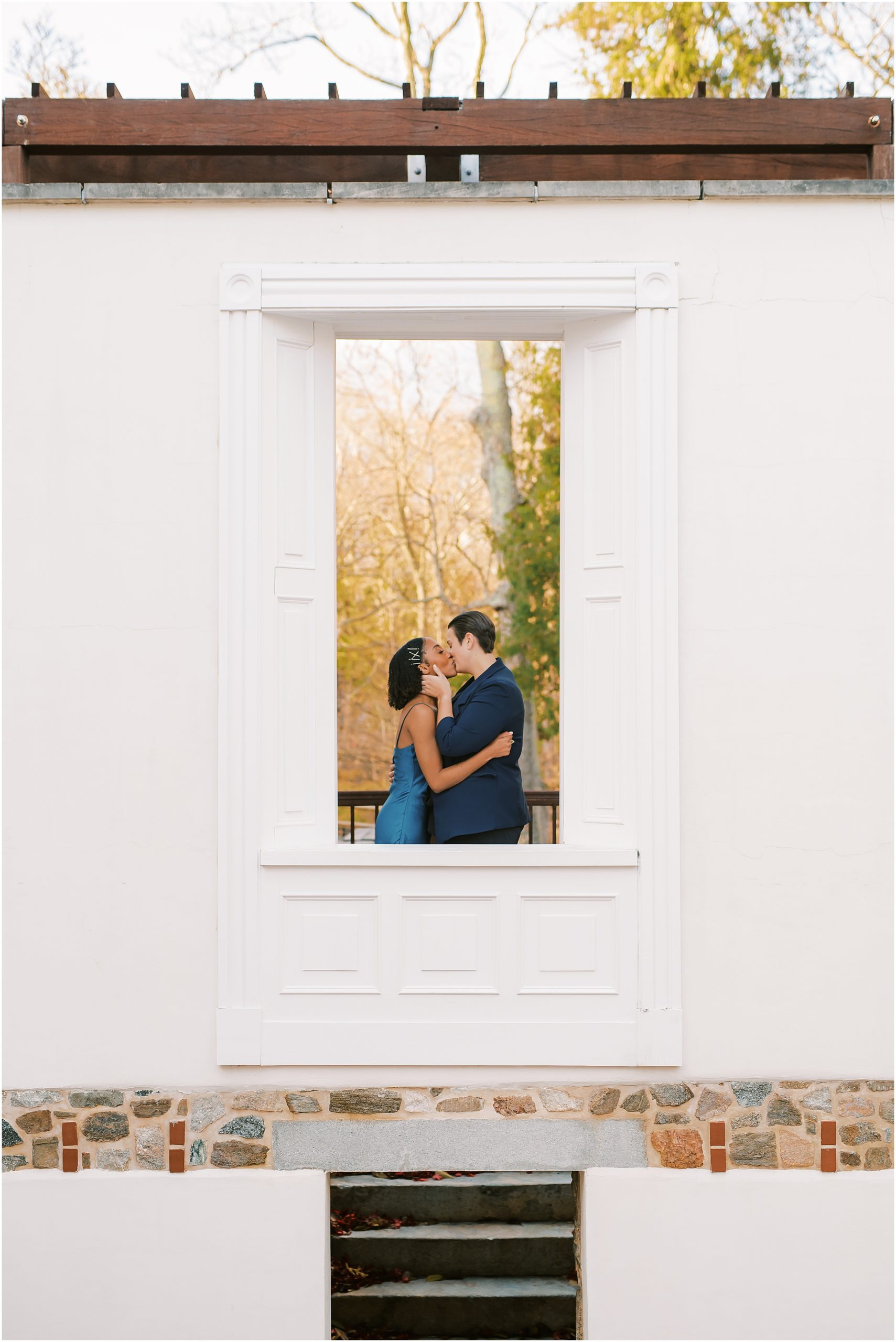 Couple kissing through window