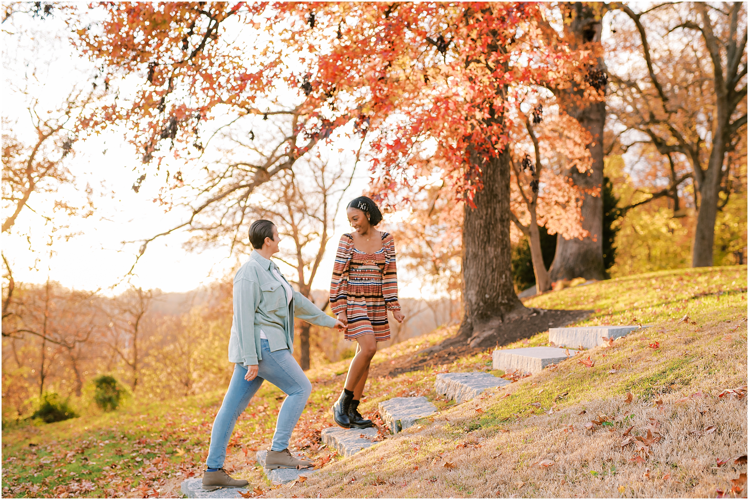 Couple walking up stairs during fall engagement session