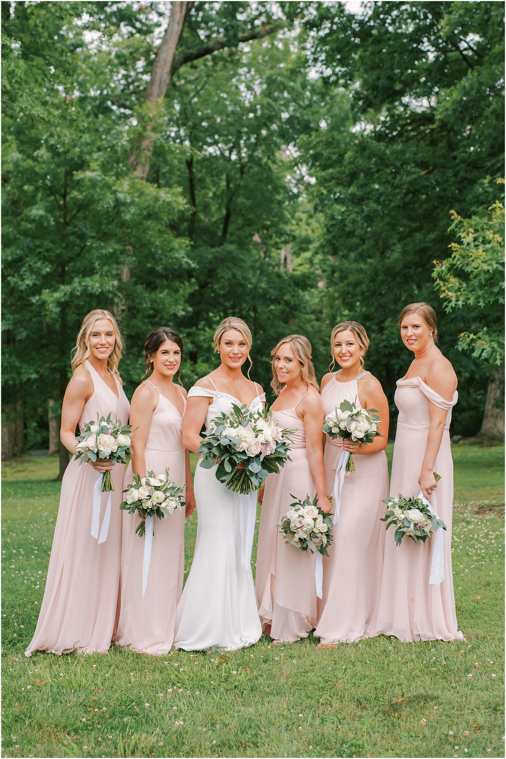 Bridesmaids in pink dresses at Rust Manor House
