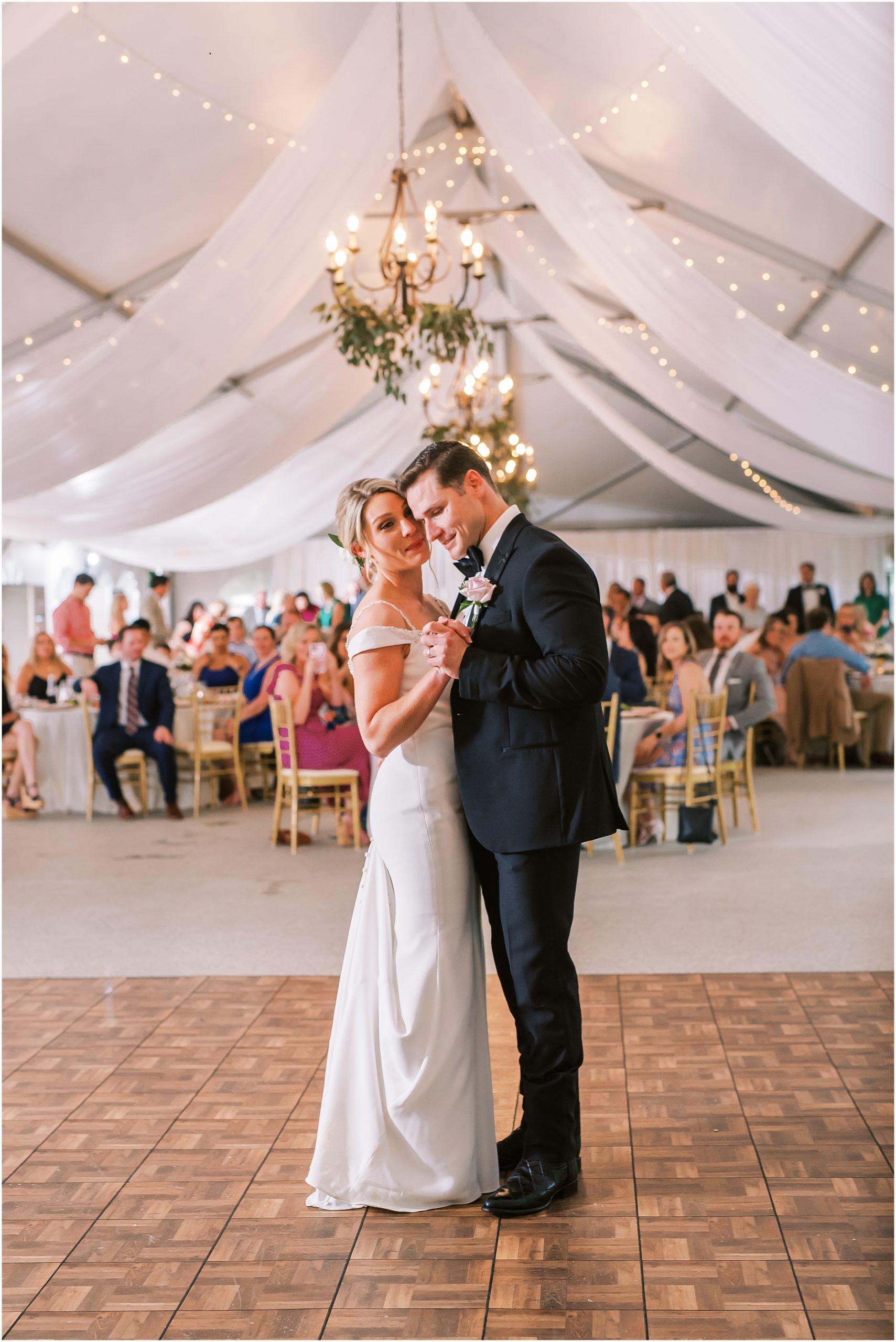 Bride and groom share first dance at their wedding
