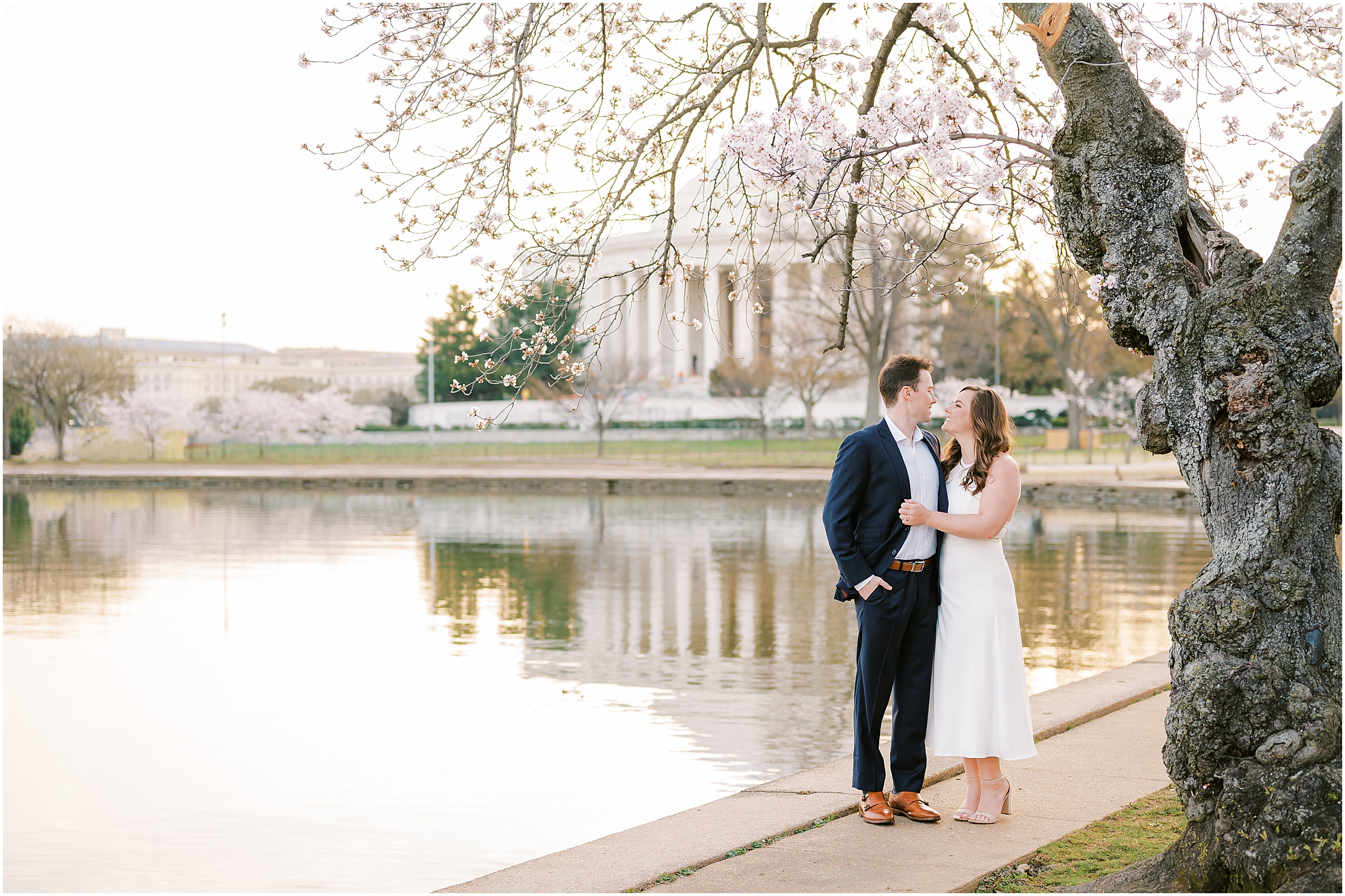 Cherry blossom engagement session with Thomas Jefferson Memorial in the background