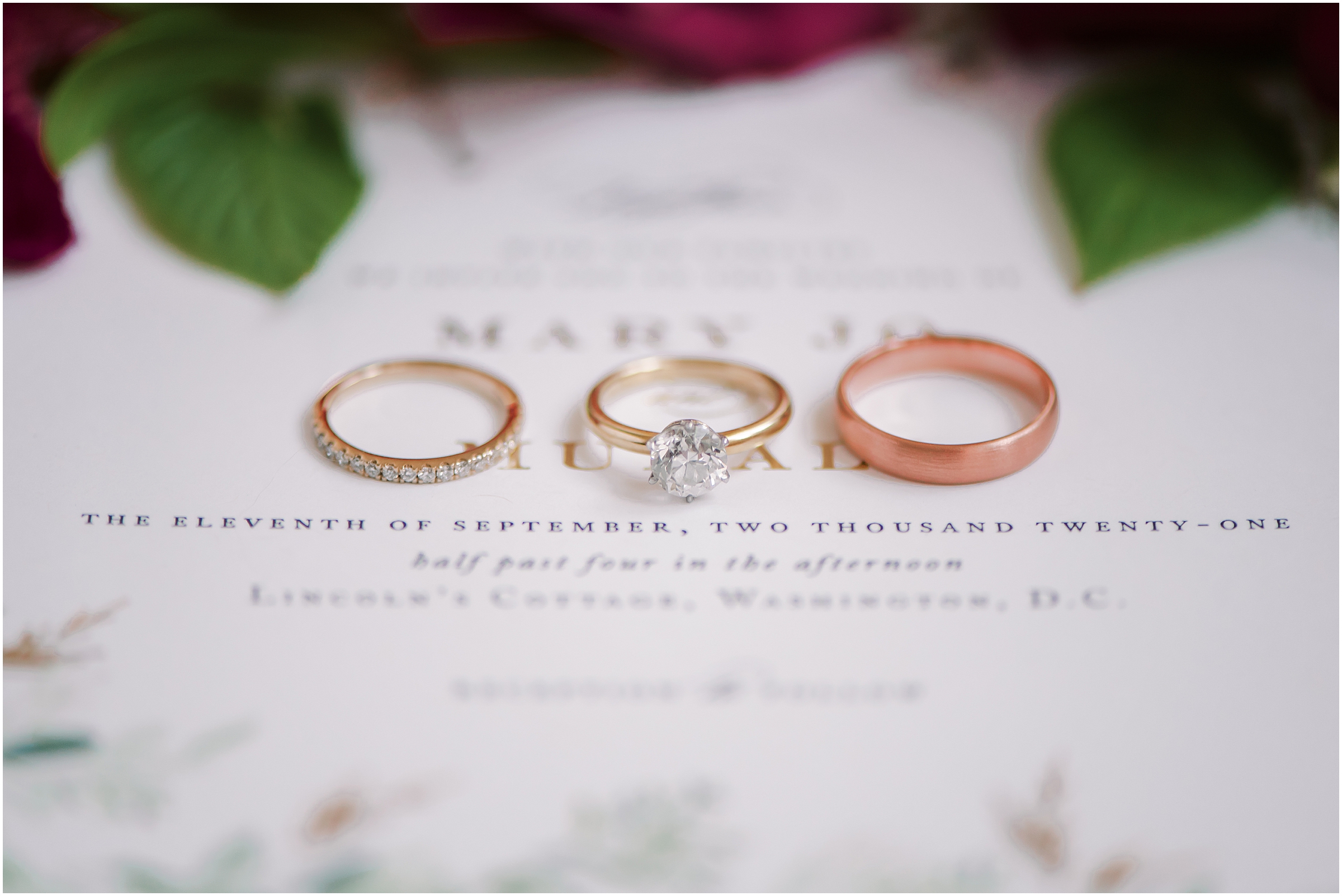 Wedding and engagement rings on invitation