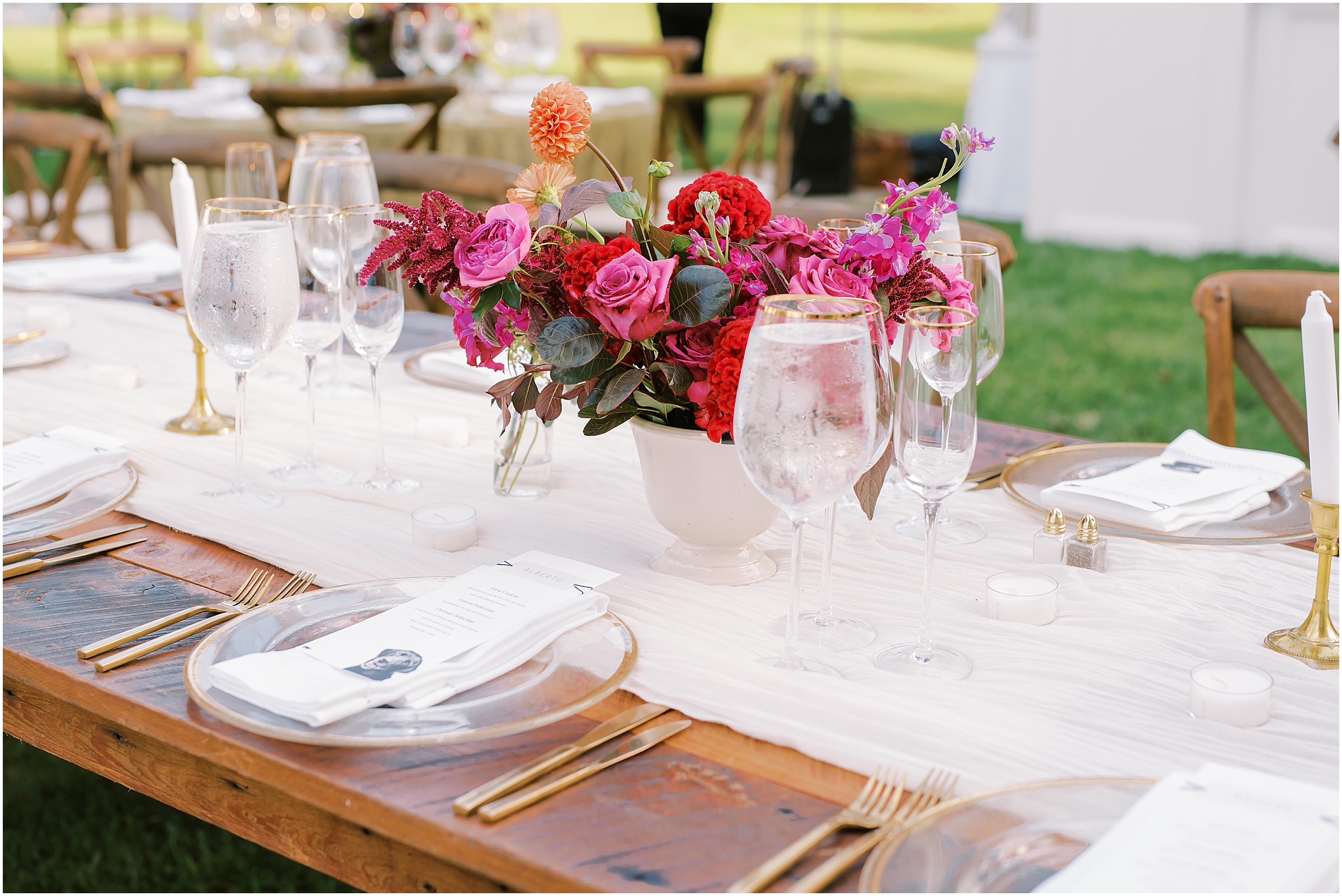 Wedding reception farm tables and gold silverware