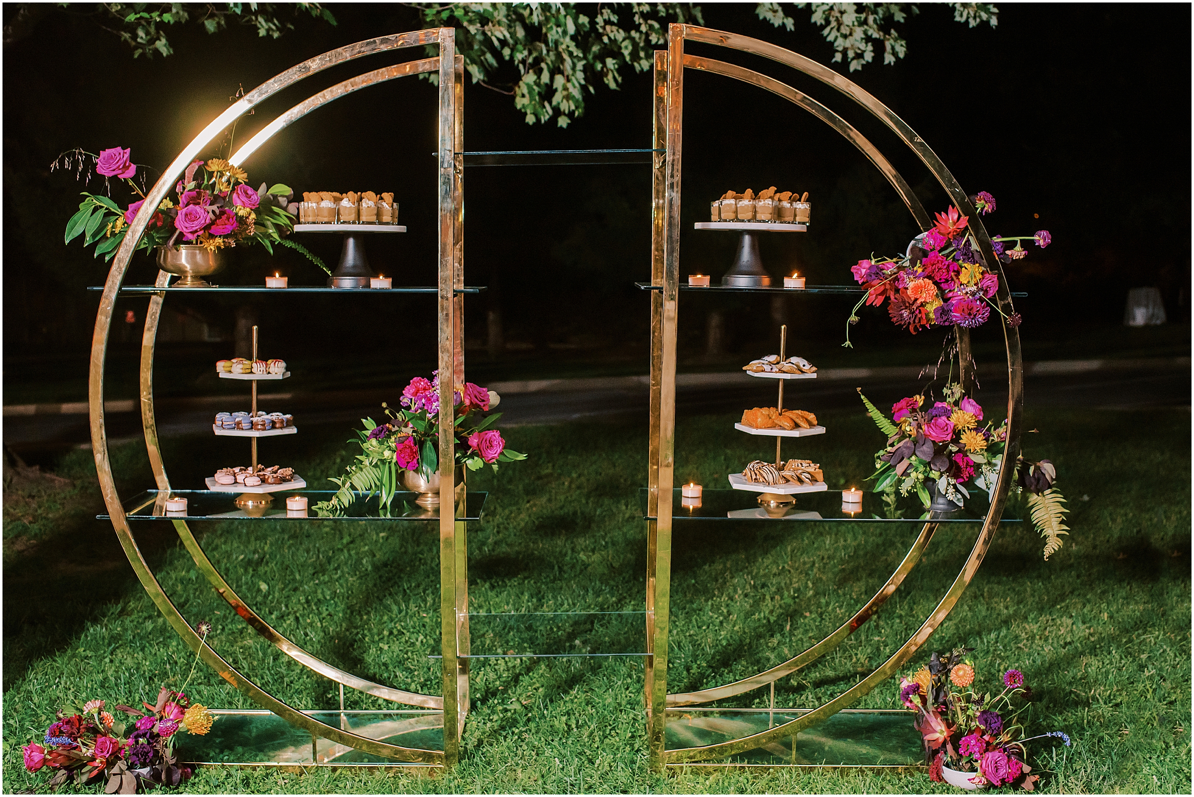 Gold arch rental with wedding desserts