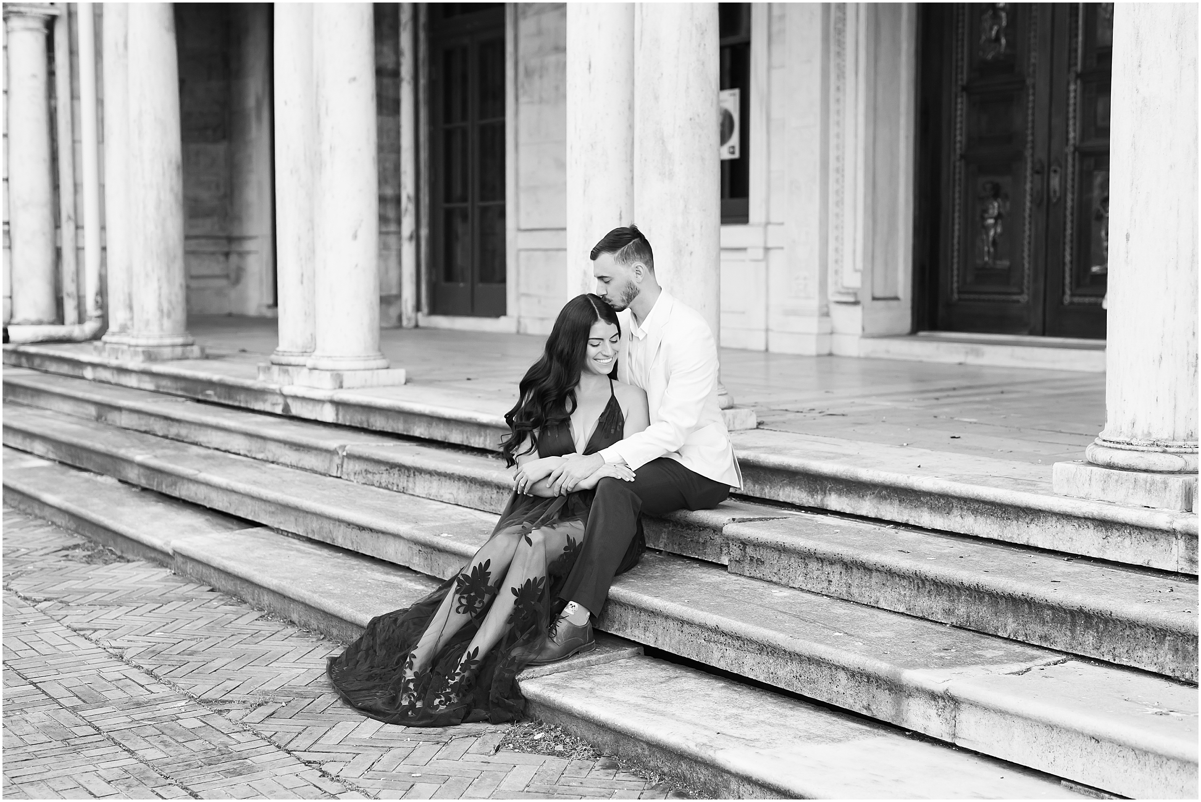 Couple sitting on steps at Swannanoa Palace