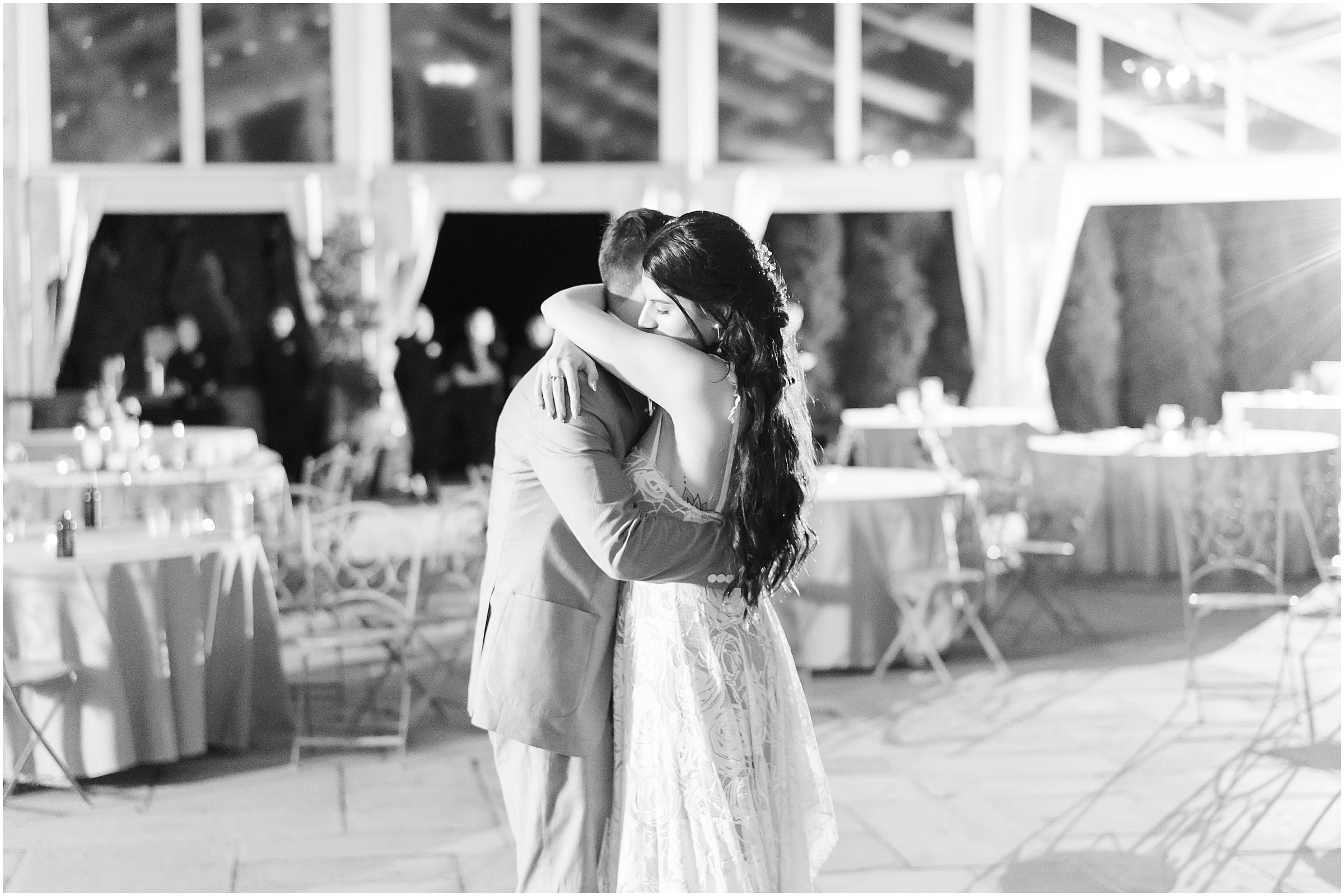 Bride and groom embrace during first dance