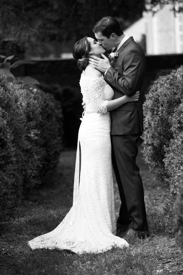 black and white bride and groom kissing