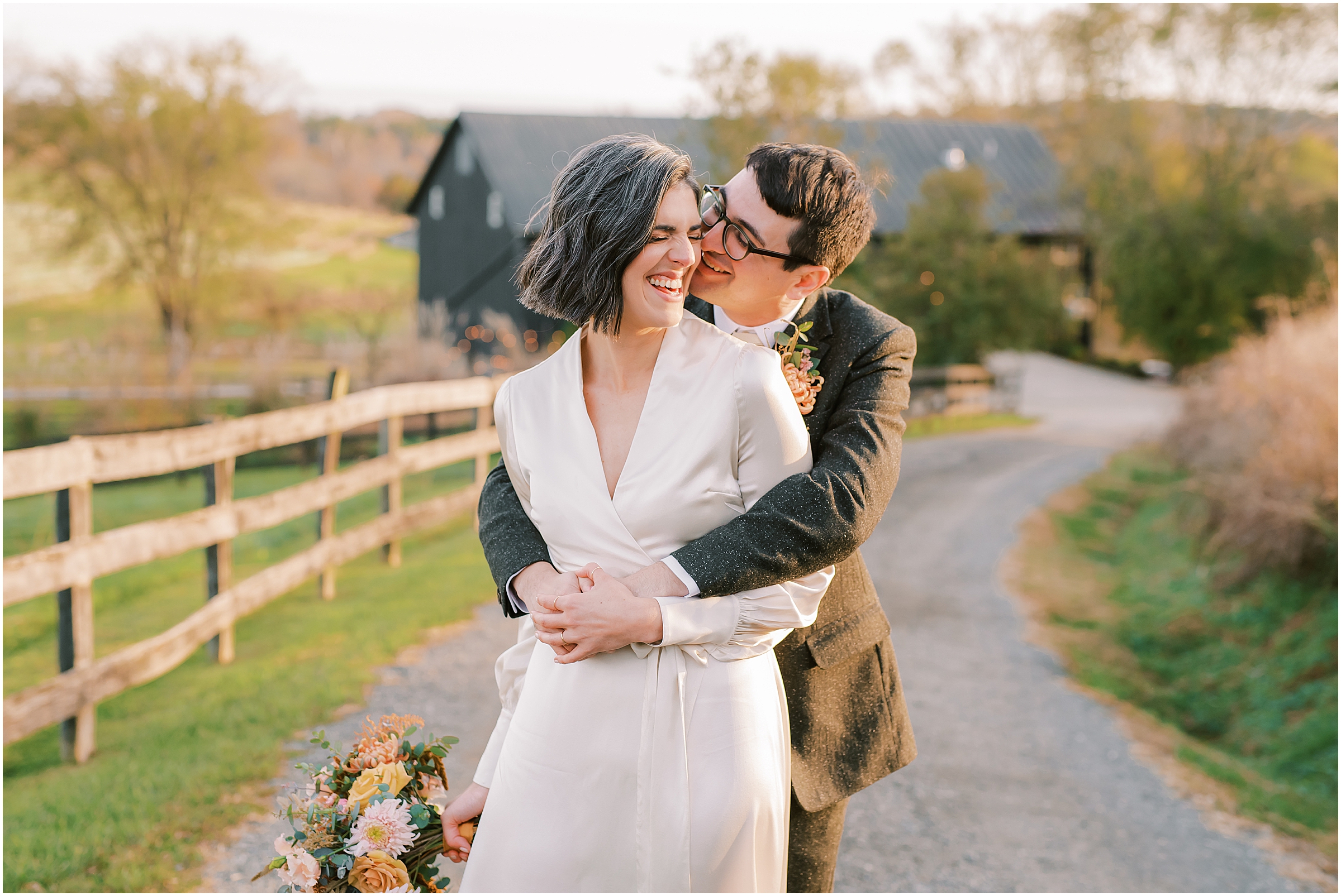 Newlyweds embracing during golden hour